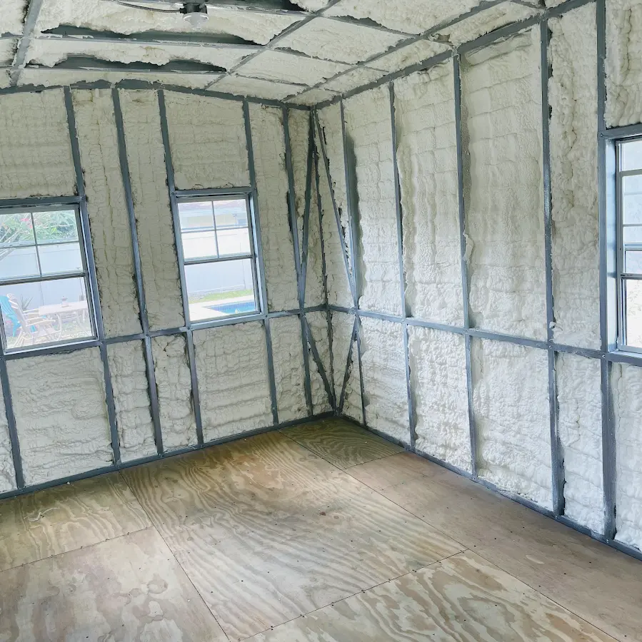 Closed-cell spray foam insulation applied to wall cavities in a residential project in Naranja